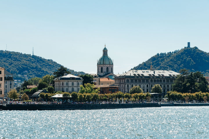 Como Cathedral and the lake with green hills under a clear sky