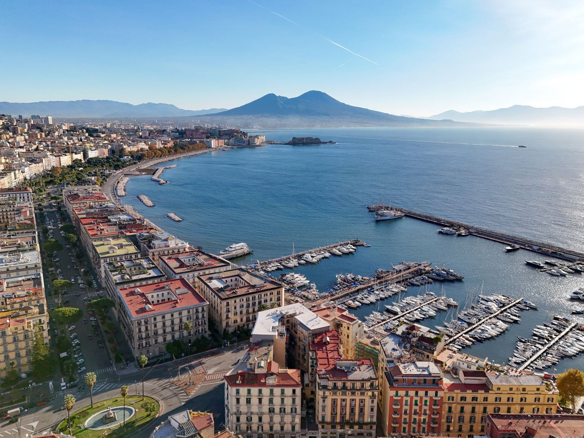 Aerial view of Naples with the dense old city, the bay and Mount Vesuvius in the distance