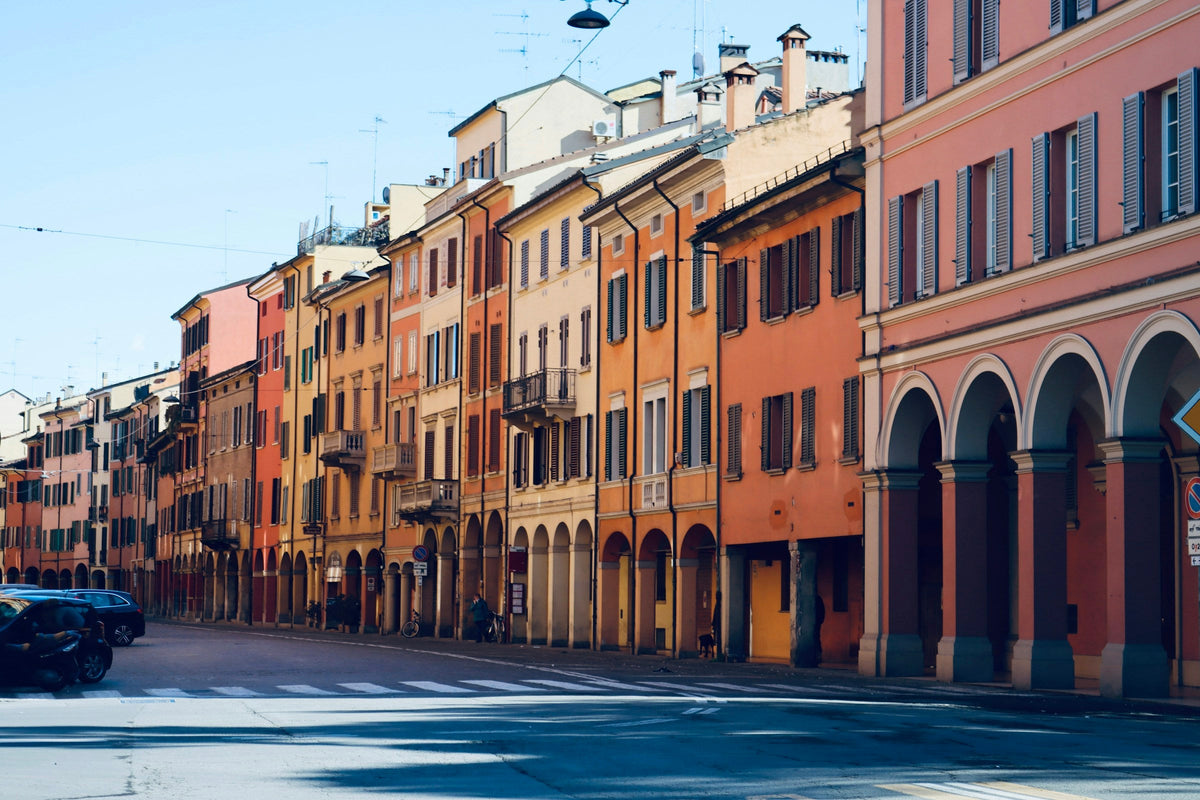 Quiet residential street with colourful facades in Bologna