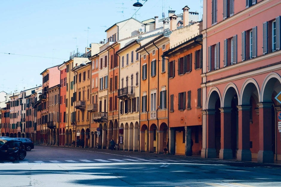 Quiet residential street with colourful facades in Bologna