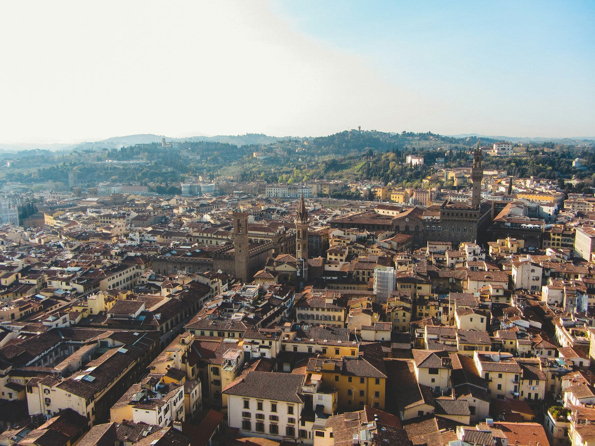 Terracotta roofs of Florence's dense historic centre seen from the Duomo cupola, the area where new short-term rentals are blocked