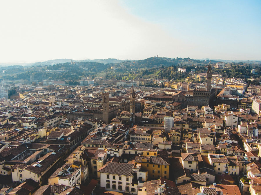 Terracotta roofs of Florence's dense historic centre seen from the Duomo cupola, the area where new short-term rentals are blocked