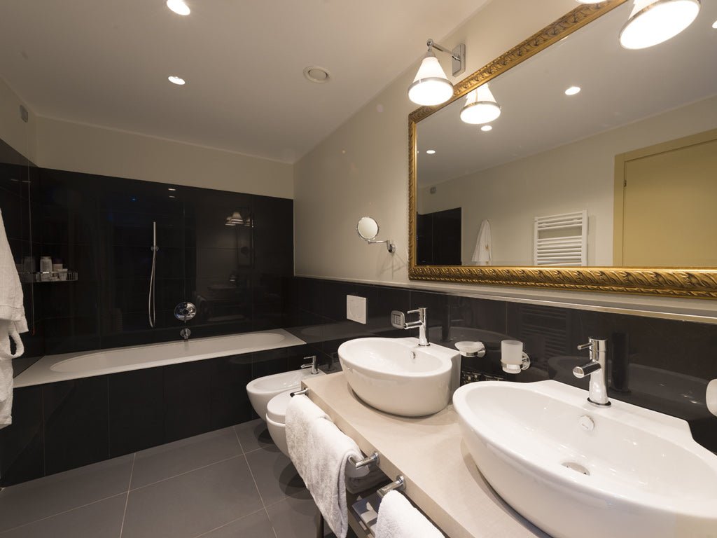 A Junior Suite bathroom at Palace Hotel Como