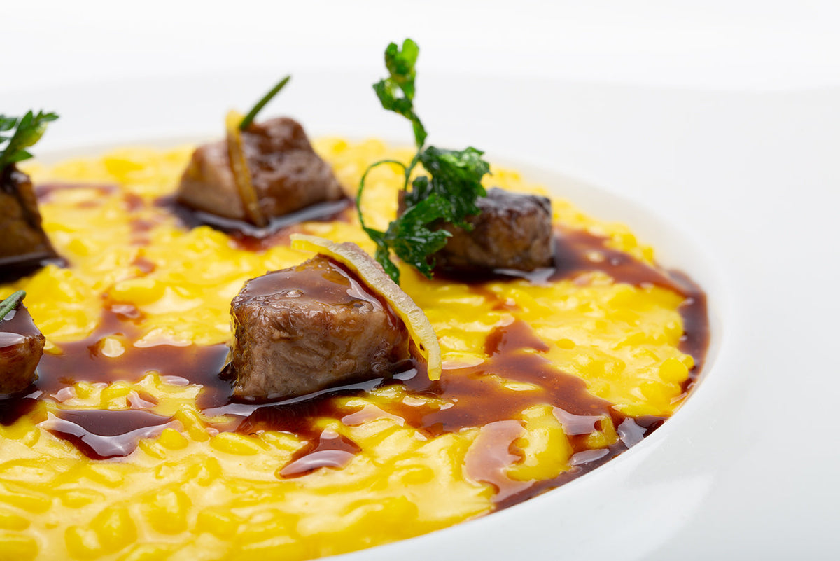 Saffron risotto with meat at Comi 107