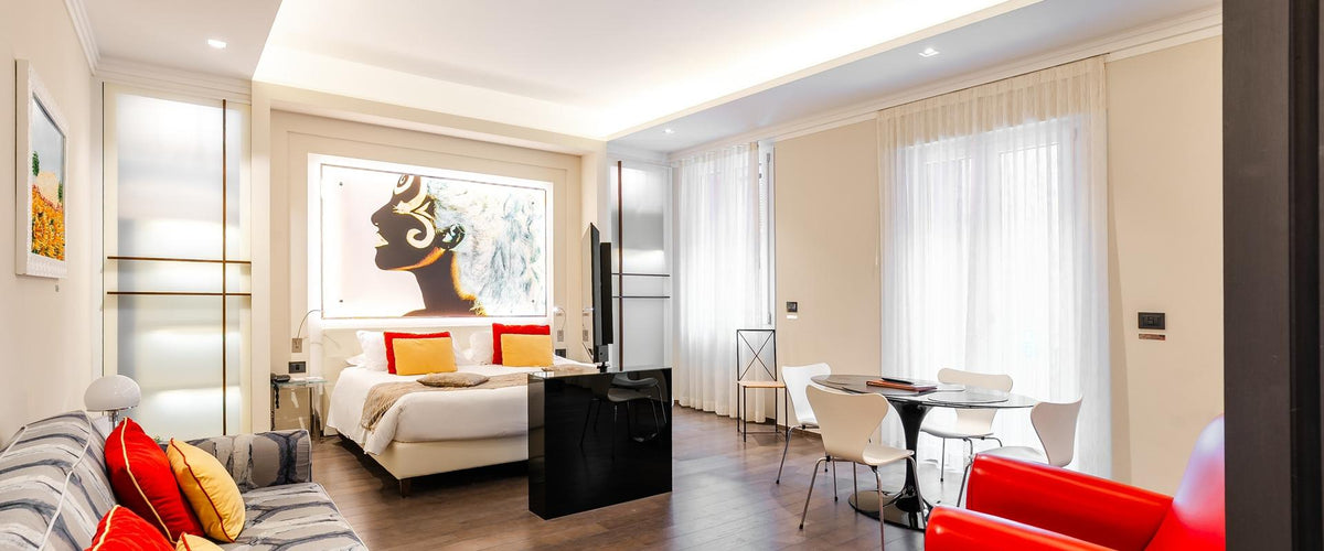 A guest room at Art Hotel Commercianti