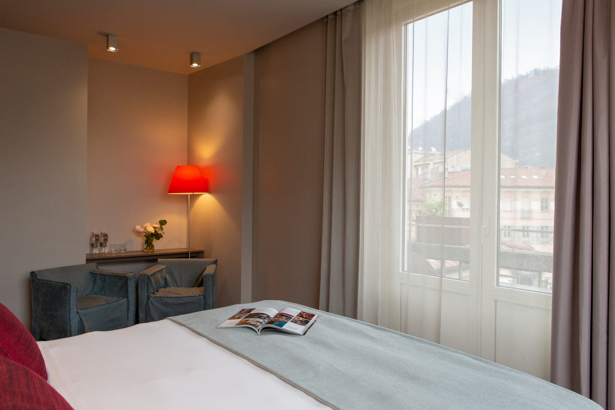 A Deluxe room at Posta Design Hotel