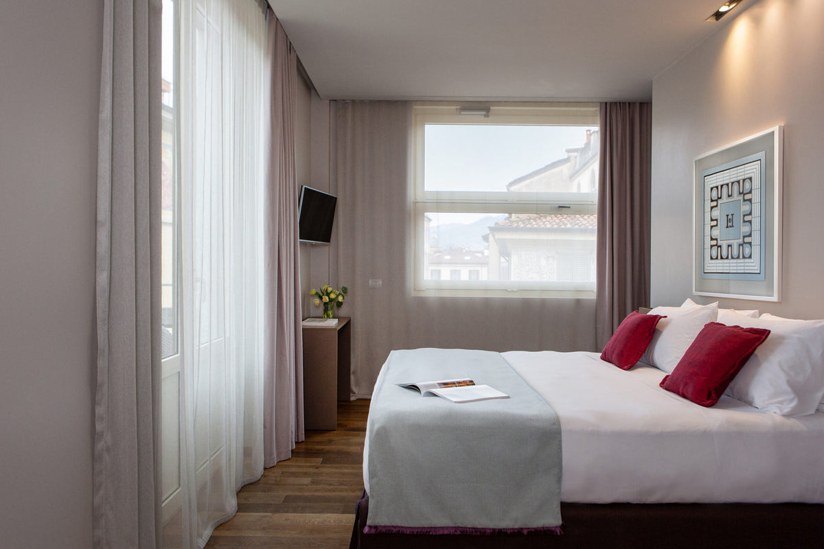 A Deluxe room at Posta Design Hotel