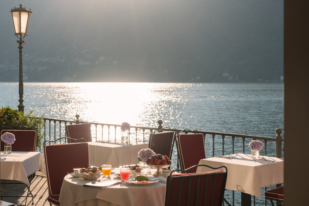 Tables on the lakeside terrace of Hotel Villa Flori