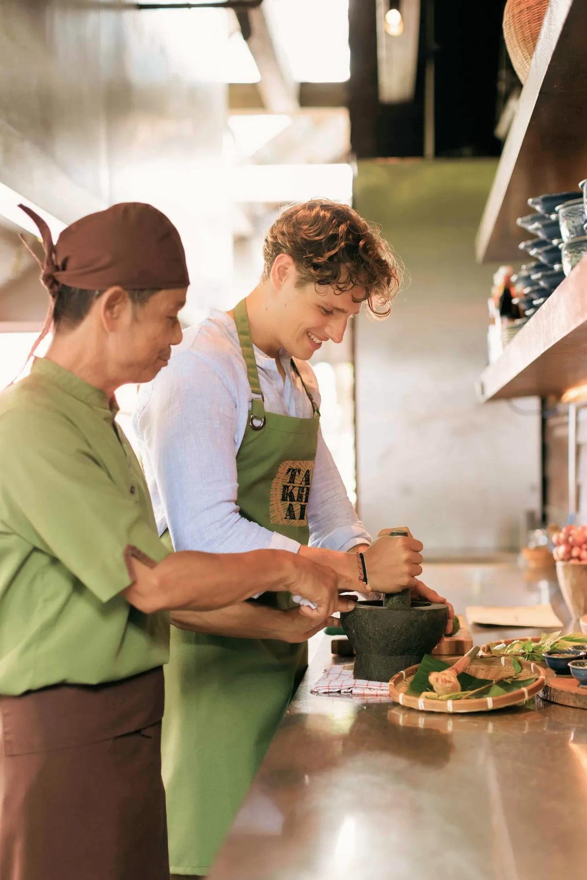Thai cooking class with mortar and pestle at Ta Khai, Rosewood Phuket
