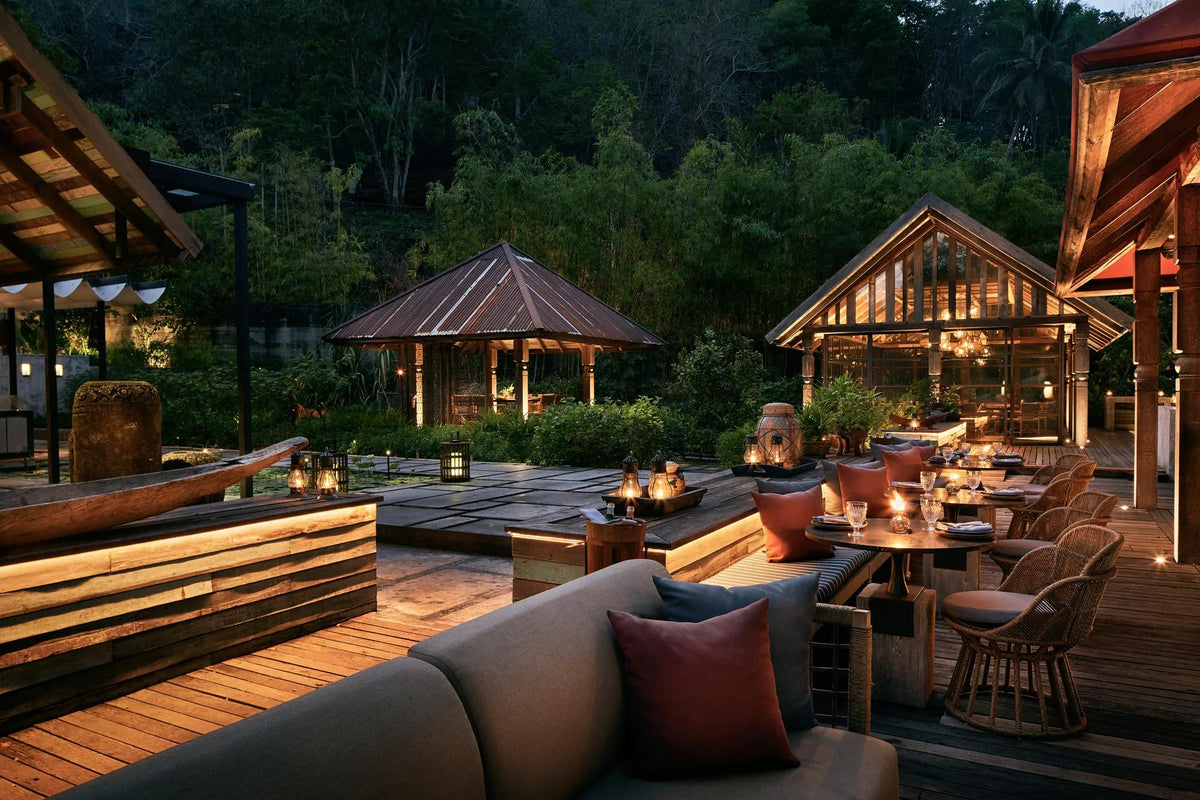 Ta Khai restaurant pavilions at dusk, Rosewood Phuket