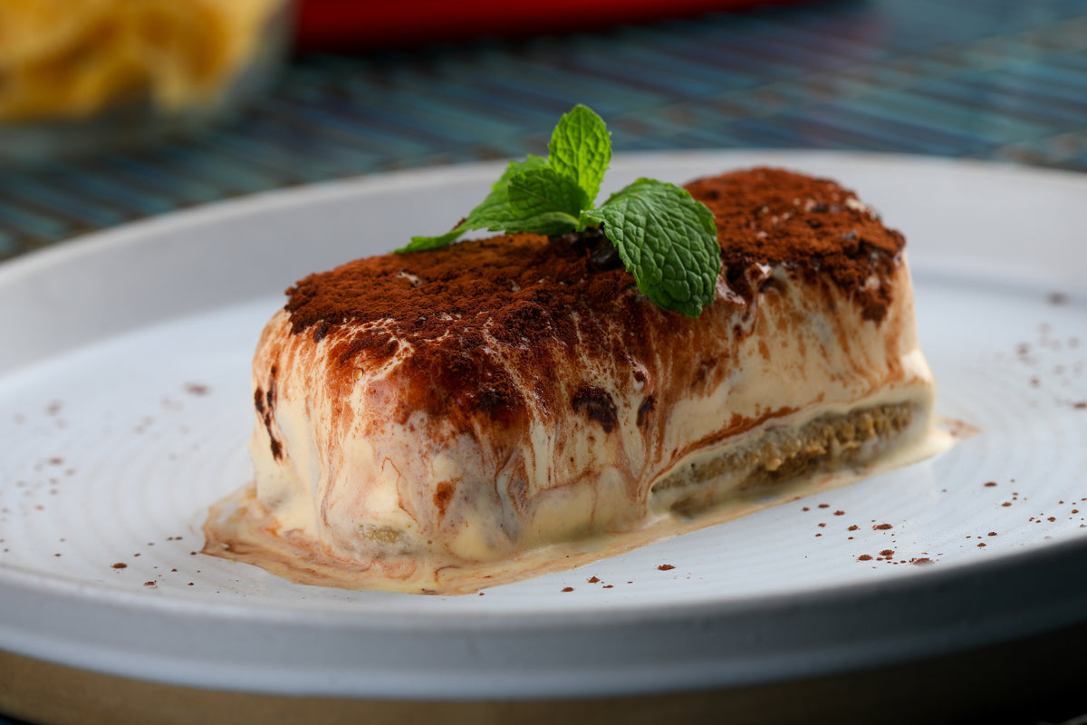 Tiramisù with cocoa and fresh mint at That's Amore
