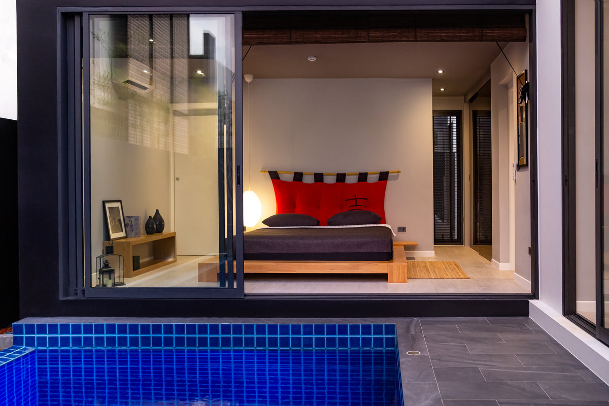 Bedroom opening straight onto the pool at Villoft Zen Living