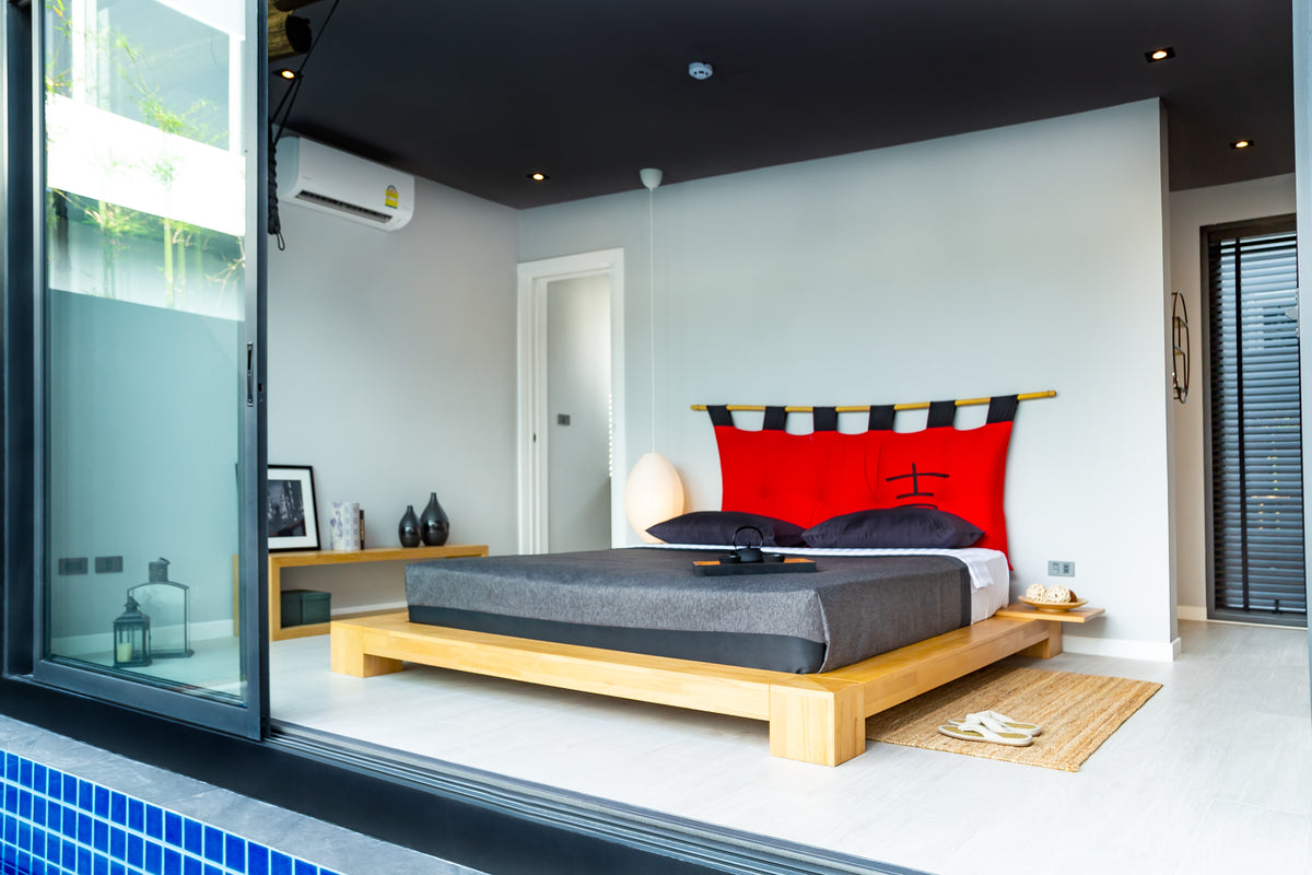 Pool villa bedroom opening onto the pool at Villoft Zen Living