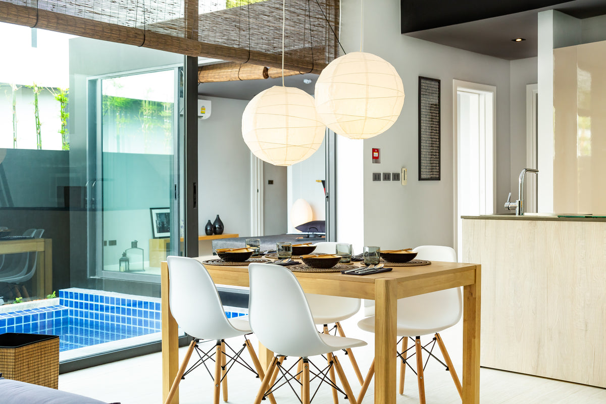 Open-plan living, dining and kitchen in a Villoft pool villa