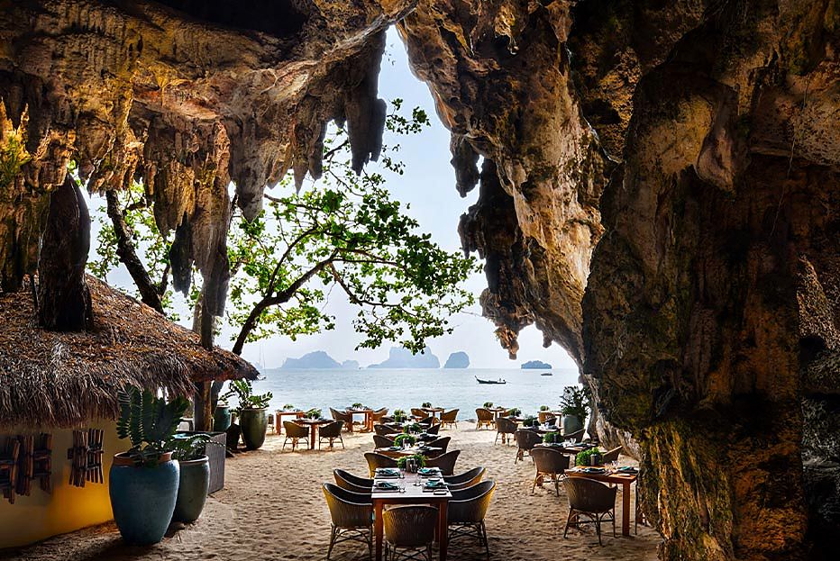 Tables beneath the limestone overhang at The Grotto