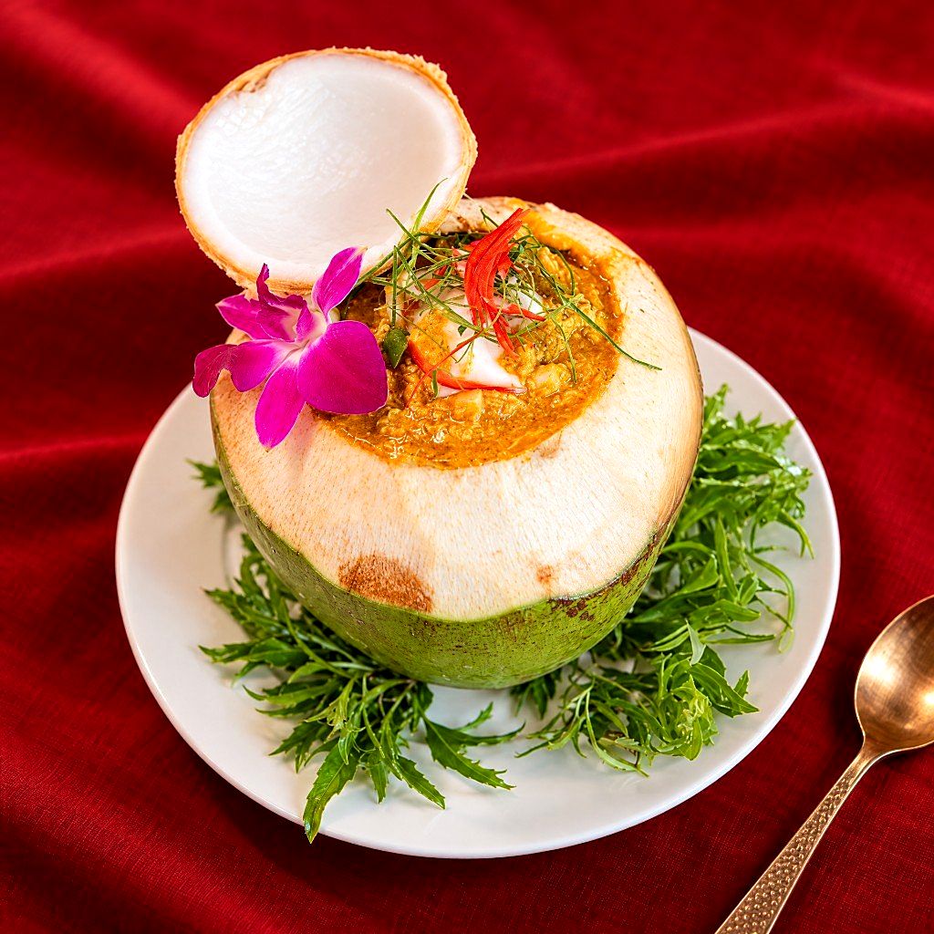 Steamed seafood curry in a young coconut at KoDam Kitchen