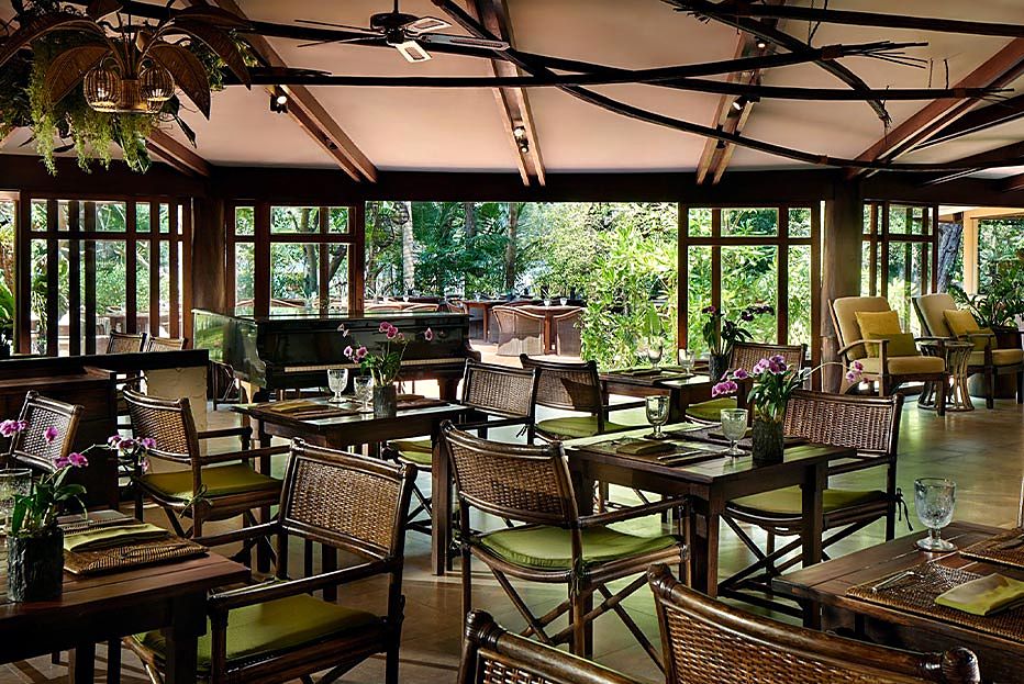 Raya Dining's open pavilion among the trees