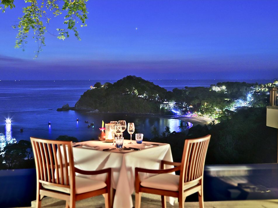 A table for two above the bay at Seven Seas, Pimalai