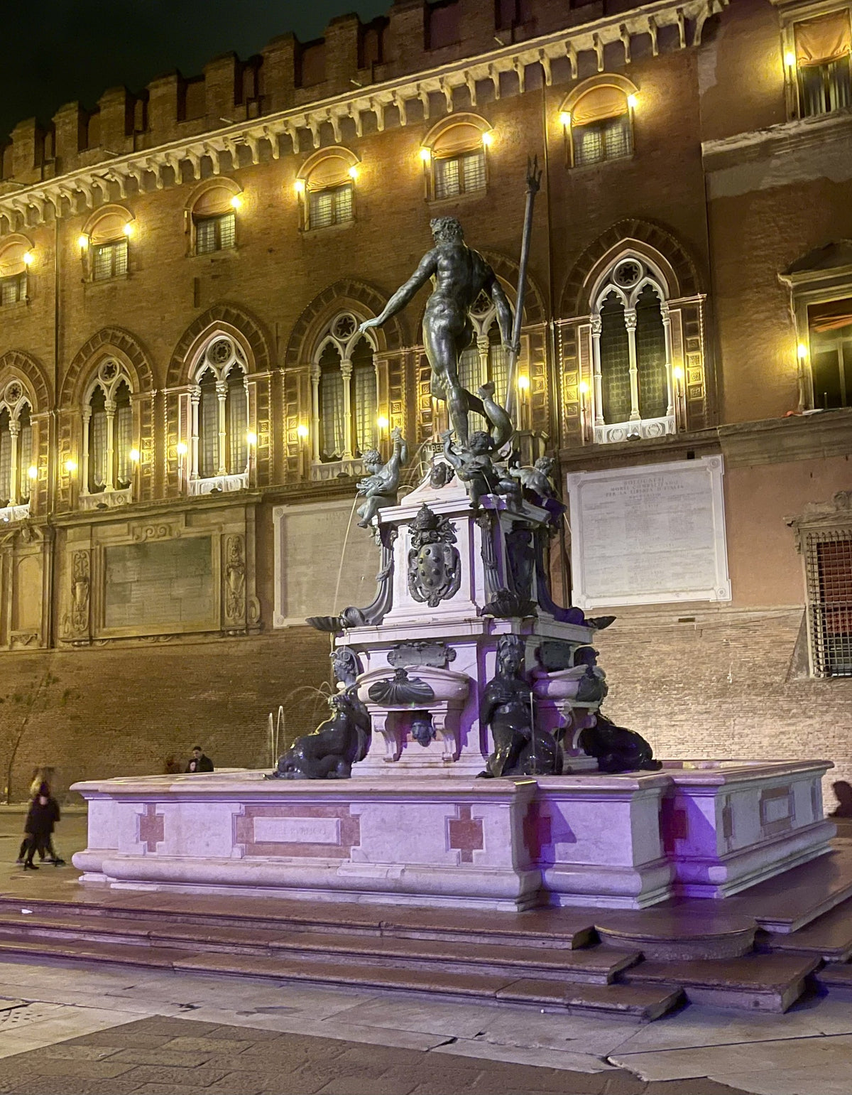 The Fountain of Neptune lit up at night