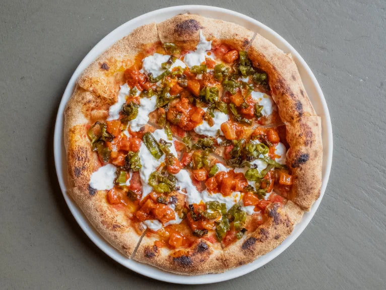A summer pizza topped with pineapple at Berberè