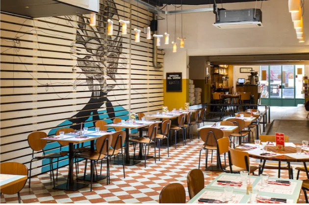 The dining room of the Via Petroni pizzeria at Berberè