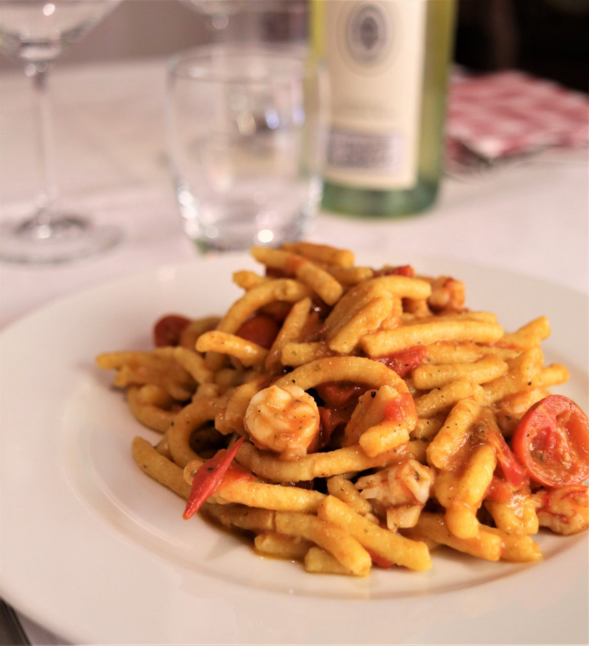 A plate of short pasta with prawns and cherry tomatoes at Dal Biassanot