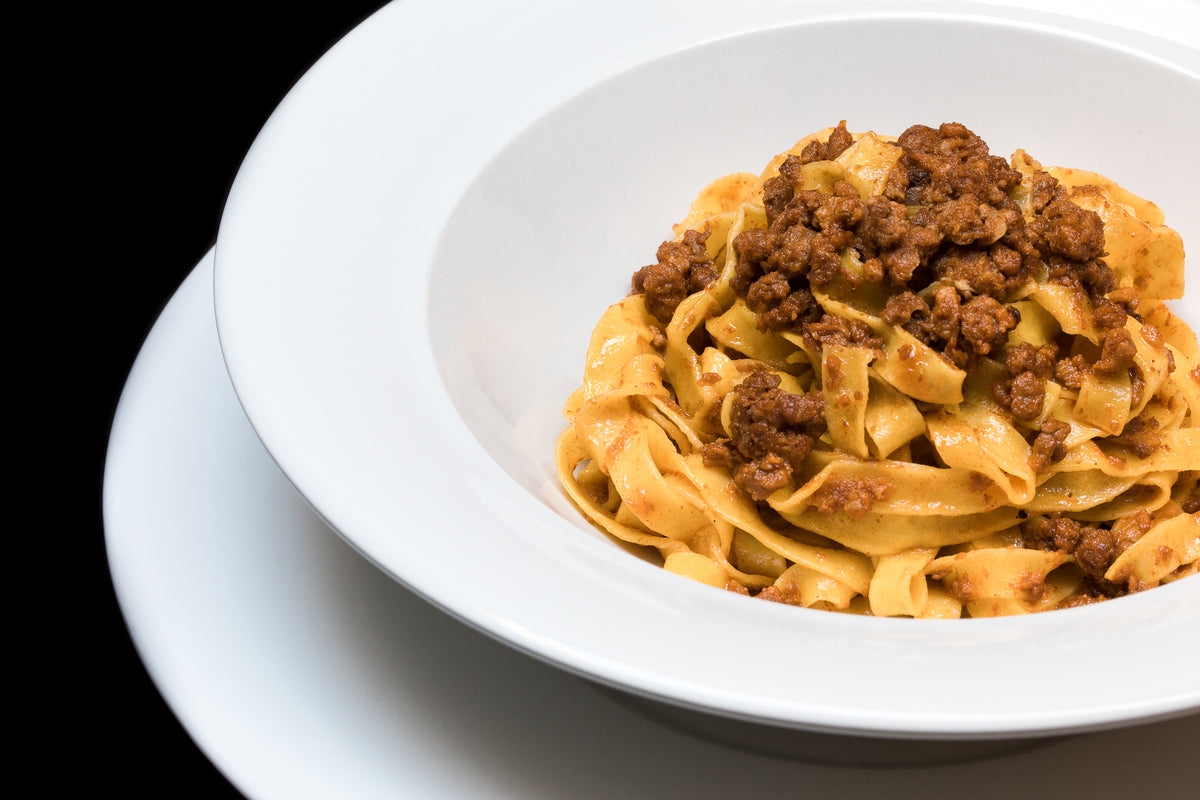 A plate of tagliatelle with ragù at Caminetto d'Oro