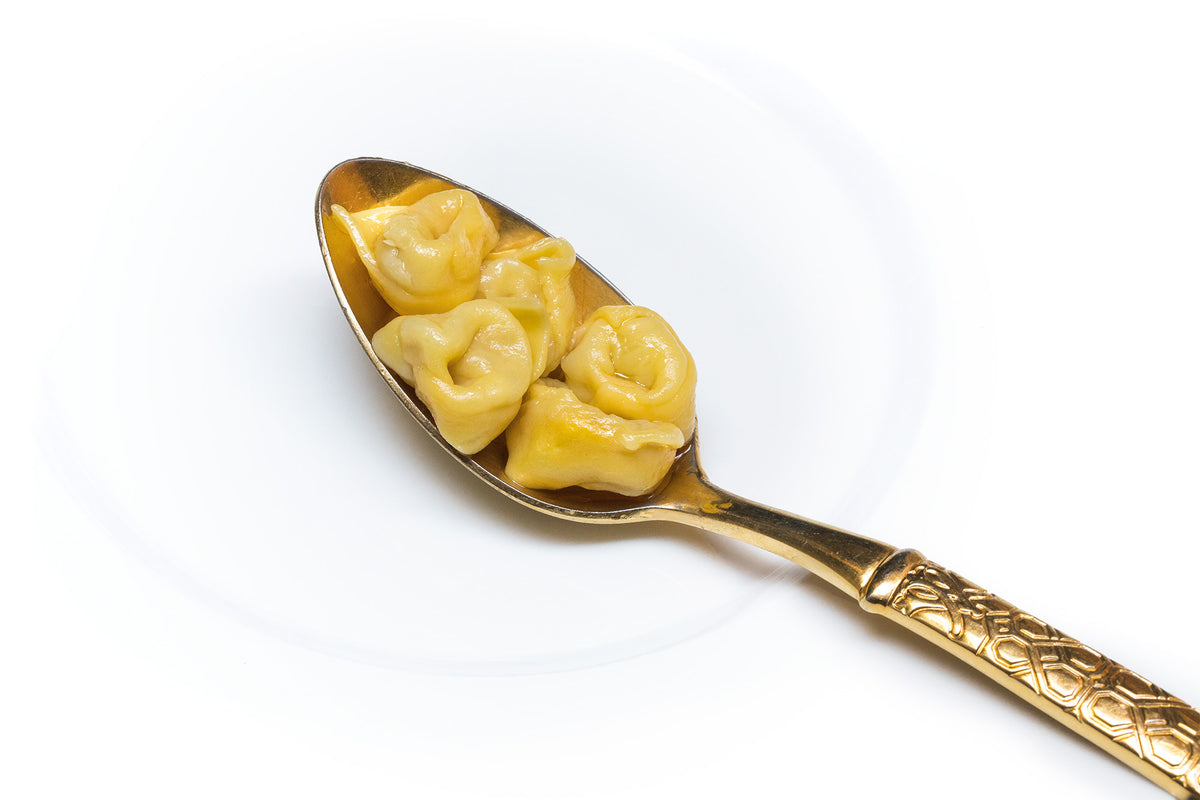 Tortellini on a gilded spoon at Caminetto d'Oro