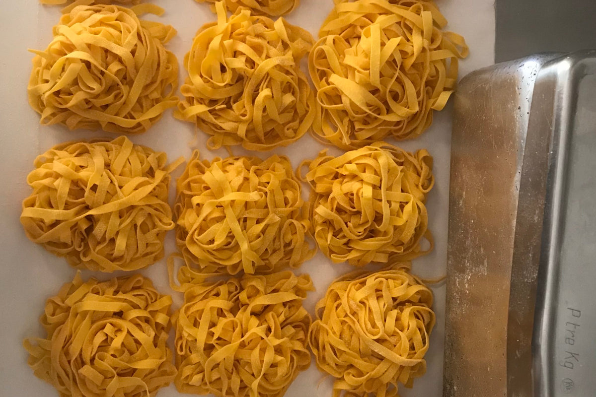 Nests of fresh tagliatelle at Caminetto d'Oro