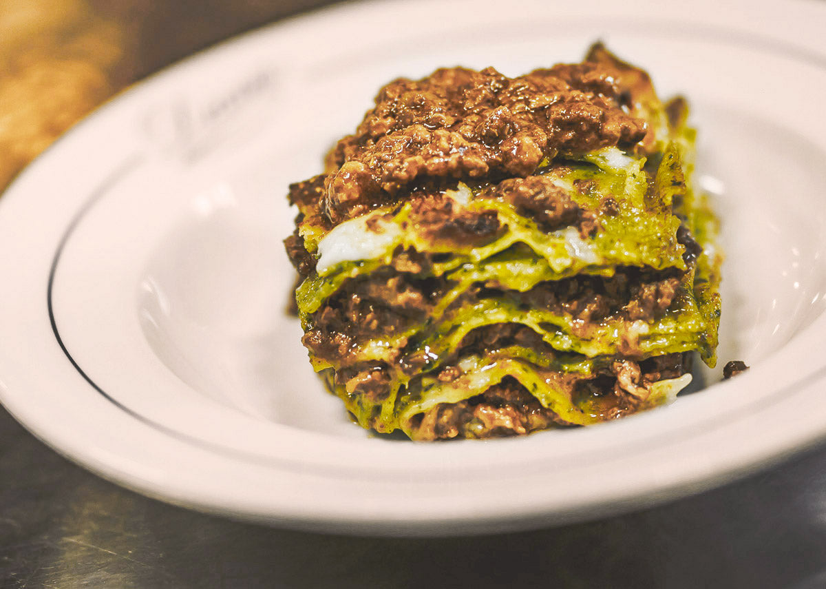A slice of green lasagne at Diana
