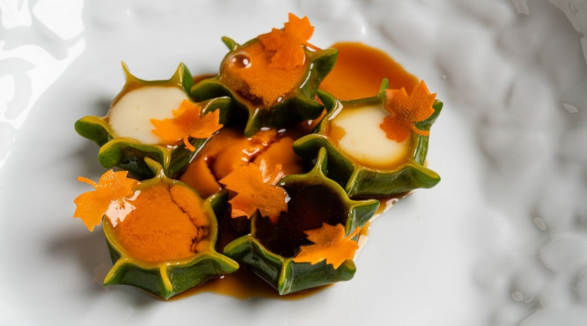 Filled pasta with sauce and orange petals at I Carracci