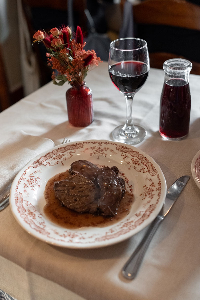 A plate of meat in sauce with red wine at La Montanara