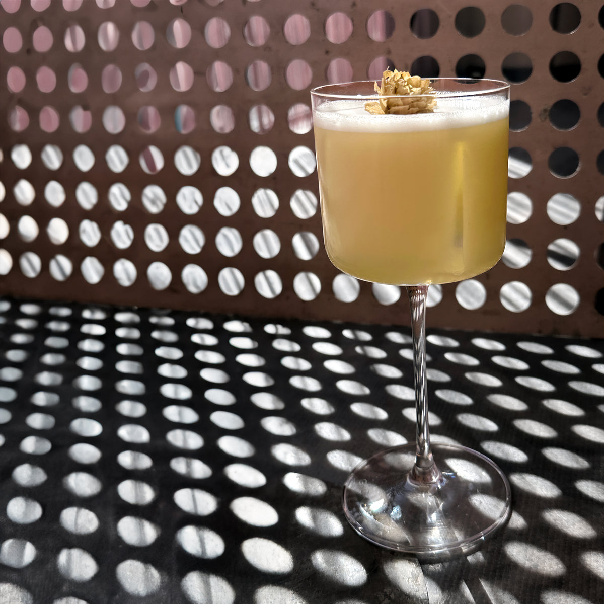 A cocktail served in a coupe glass at Oltre.