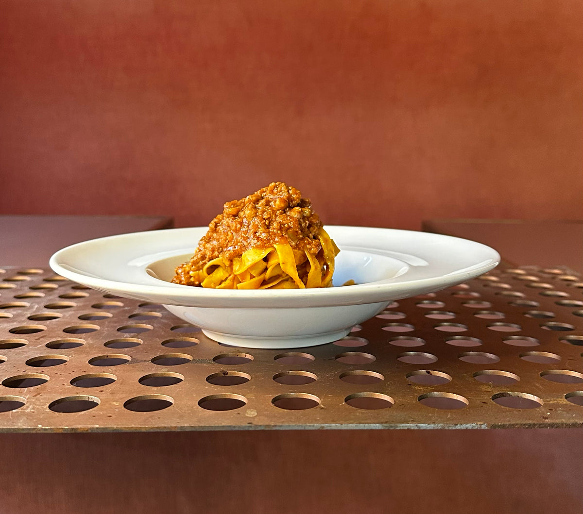 A bowl of tagliatelle with ragù at Oltre.