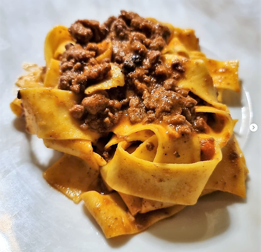 A plate of tagliatelle with ragù at Posta