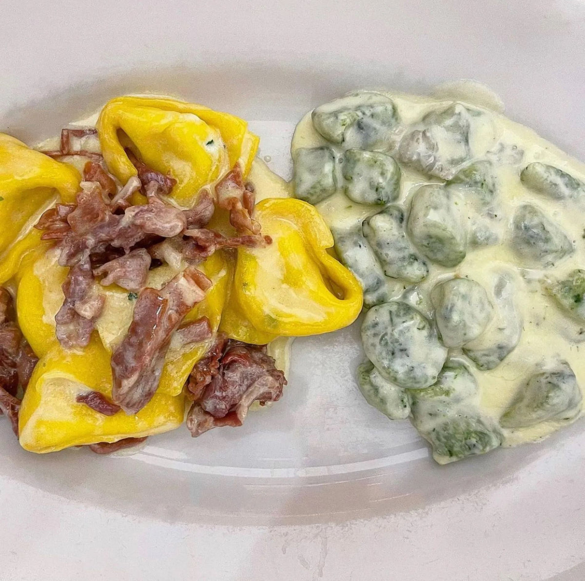 Tortellini with cured meat and green gnocchi in a cream sauce at Trattoria della Santa