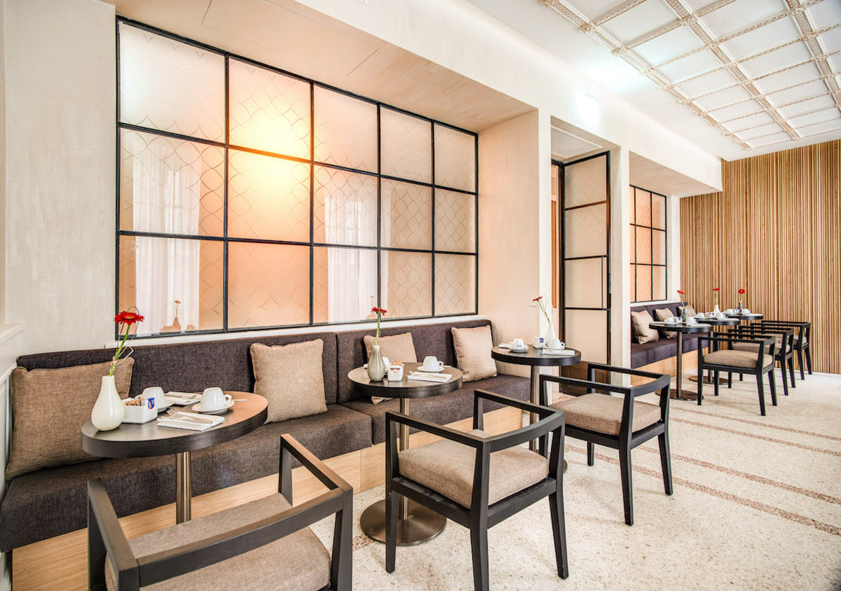 Breakfast room seating at DBH Duomo Boutique Hotel