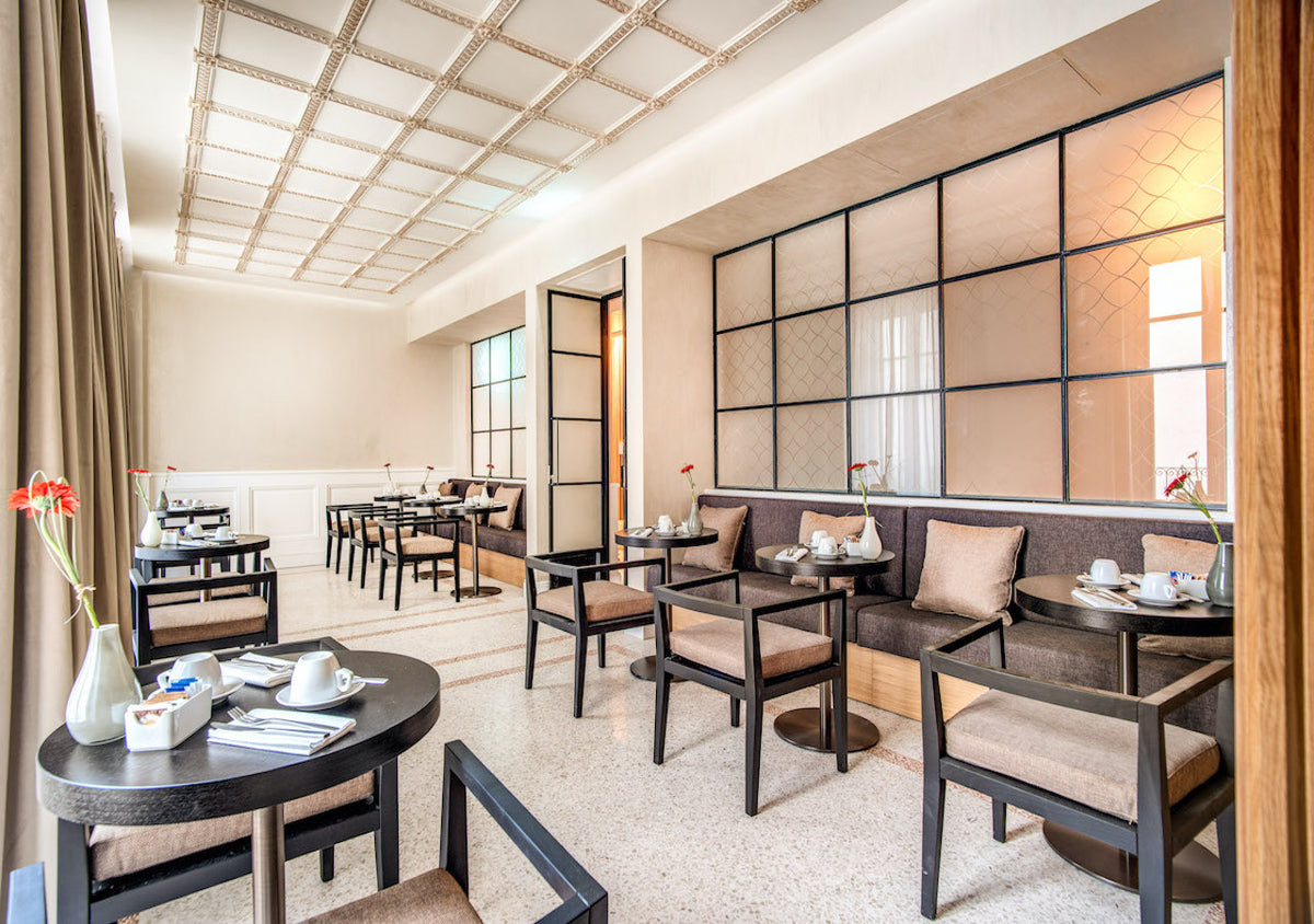 The breakfast room at DBH Duomo Boutique Hotel