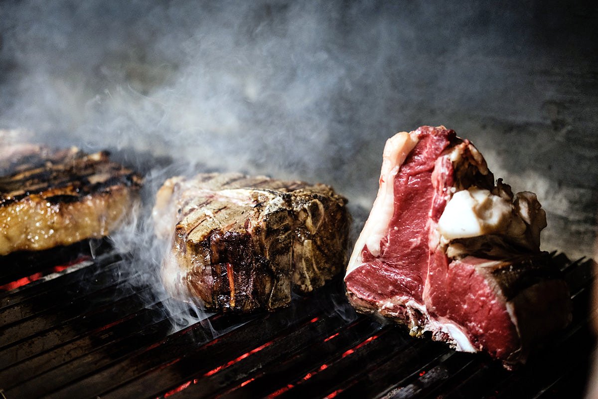 Bistecca alla fiorentina on the grill at Buca Lapi
