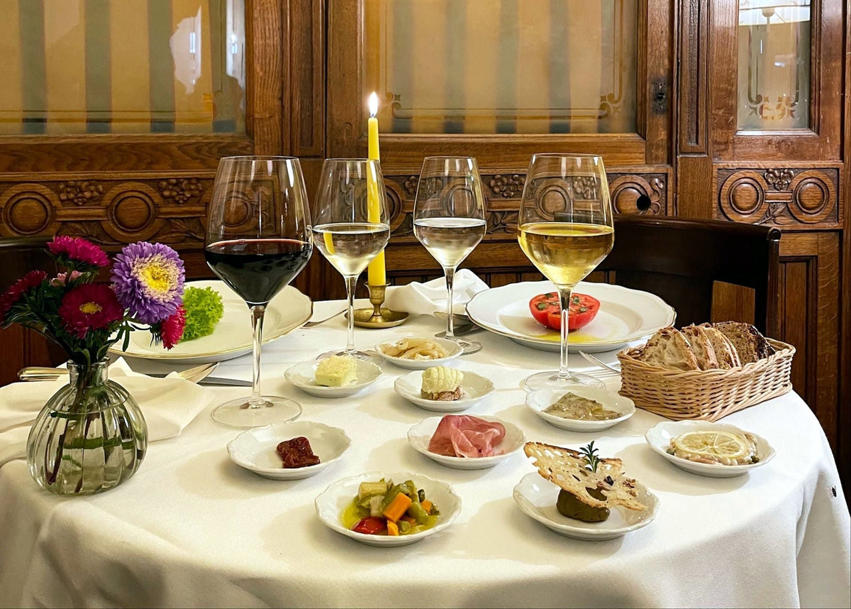 Table set with small antipasti and wine at Cibrèo Ristorante