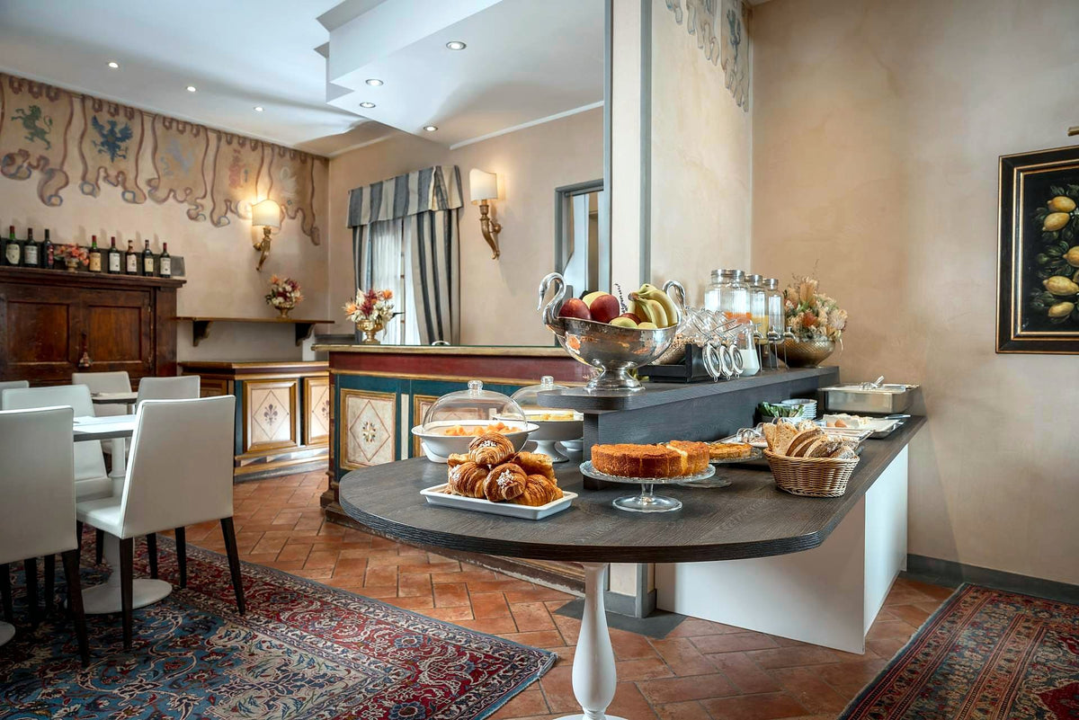 Breakfast room with buffet and painted walls at Hotel Davanzati