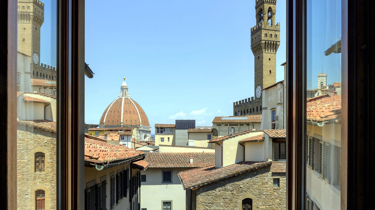 Duomo and Palazzo Vecchio tower seen from a room window at Hotel degli Orafi