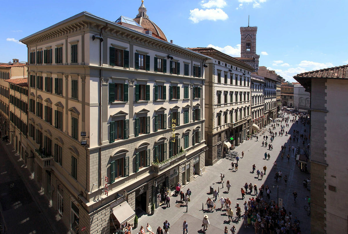 Exterior of Hotel Spadai on Via de' Martelli, with the Duomo dome behind