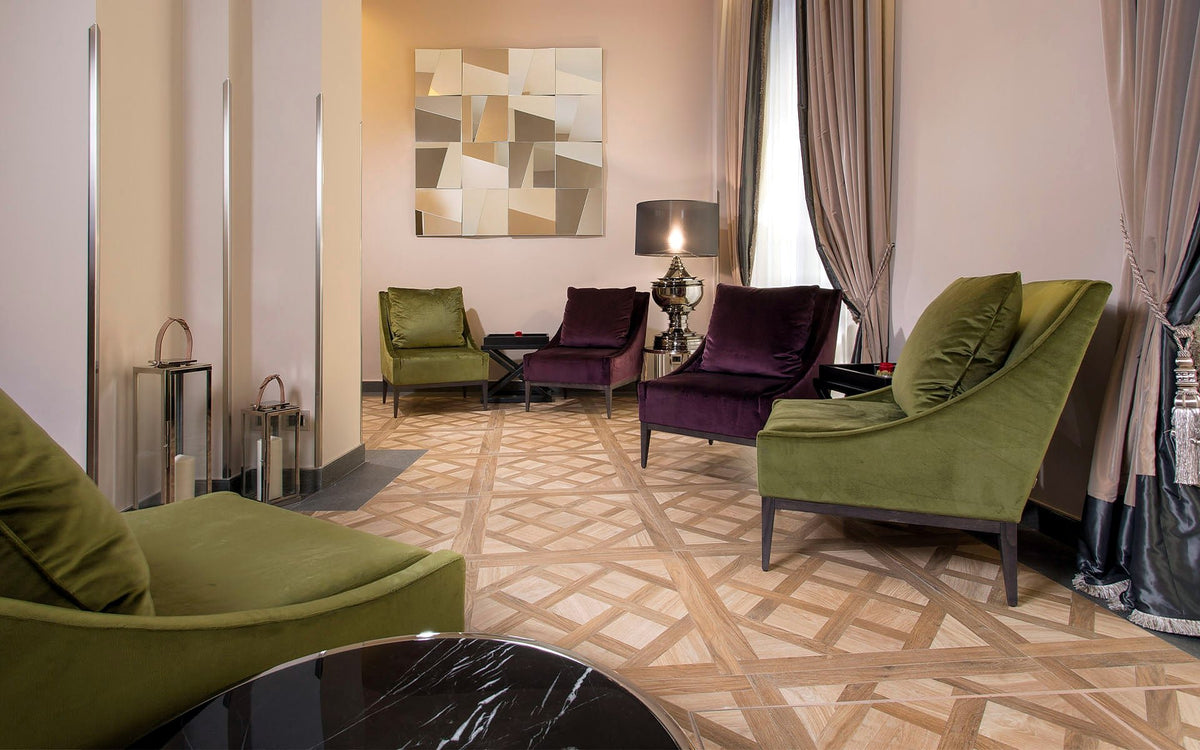 Lounge with green and plum velvet armchairs at Hotel Spadai