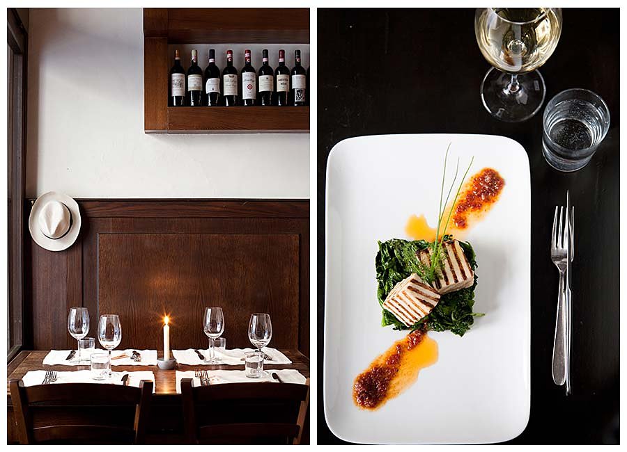 Dining room with wine shelf and a plated dish at Il Santo Bevitore