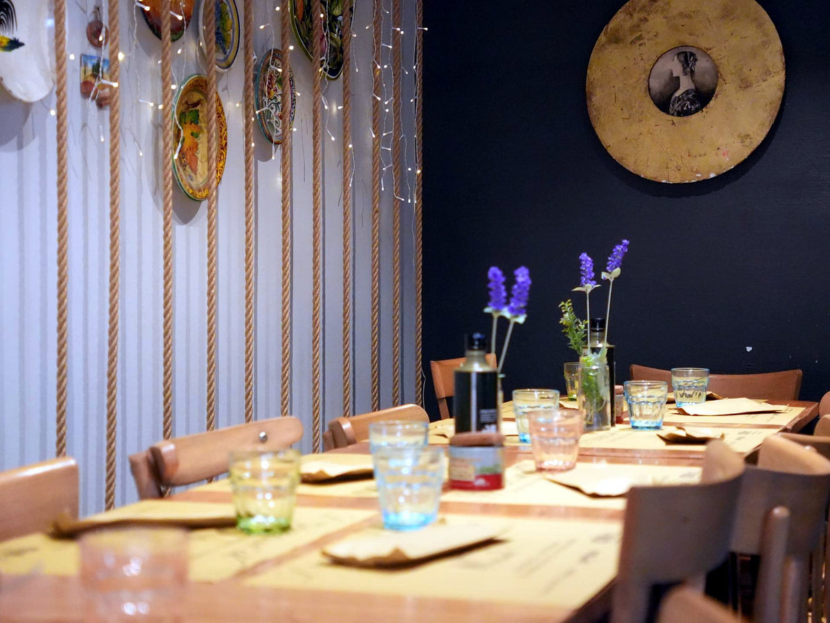 Dining room with laid tables at Osteria dell'OK