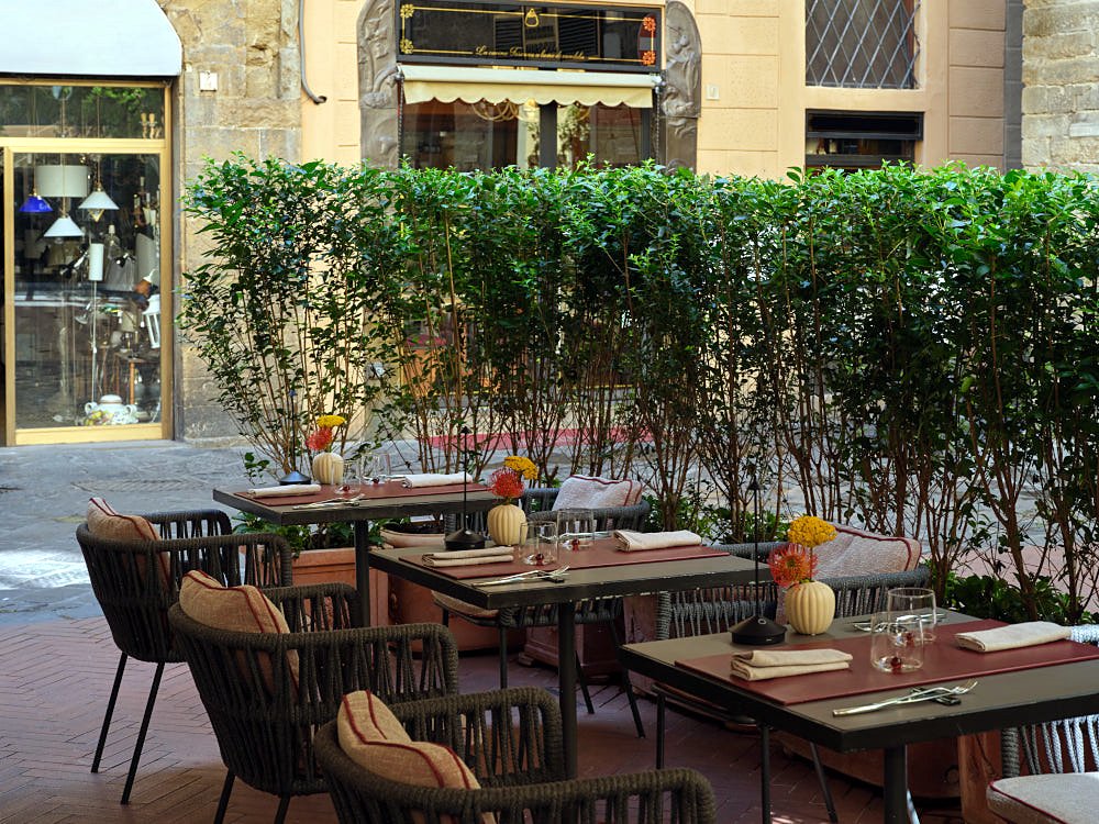 Outdoor dehors with set tables at Osteria Pagliazza