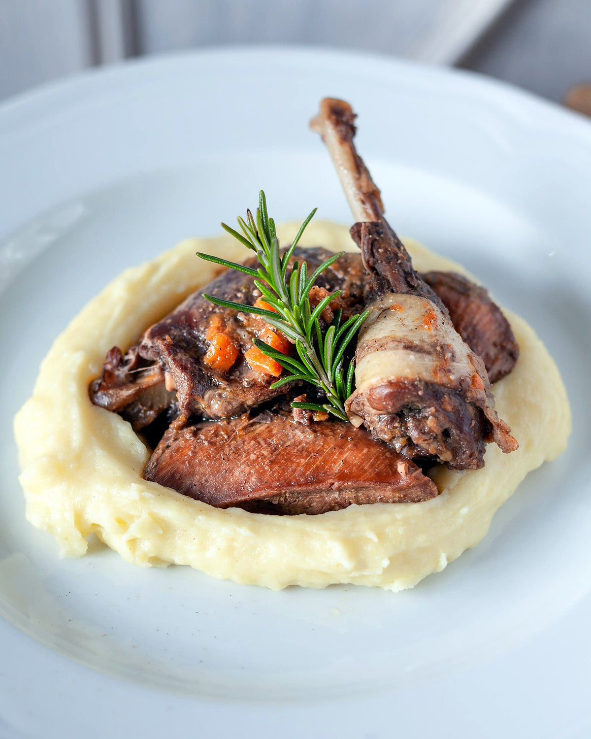 Braised fowl on mashed potatoes with rosemary at Osteria Pratellino