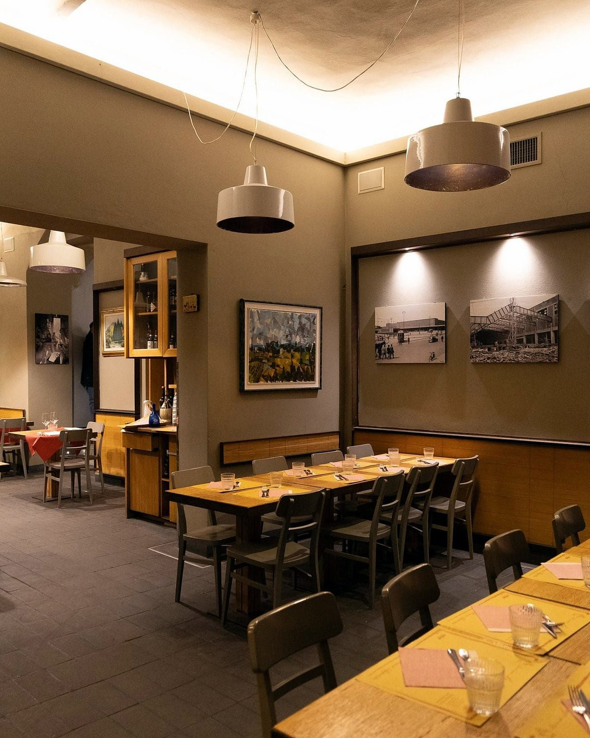 Dining room with wooden tables at Ristorante La Spada