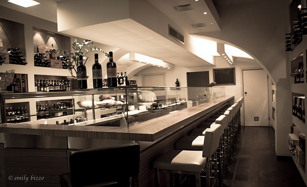 Counter with stools and wine shelves at Zeb